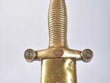 an image of a gold and black sword on a white background