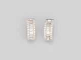 a pair of diamond hoop earrings