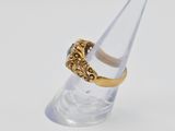 an image of a gold ring with a diamond on top of a clear cone