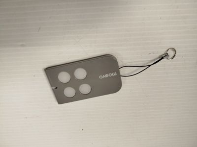 a remote that is attached to a white wall