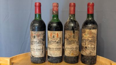 three bottles of wine sit on a wooden tray on top of a table
