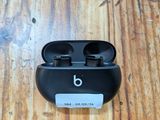 an apple airpods sitting on top of a wooden table