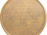 an image of a gold medal with the names of people who died in world war i