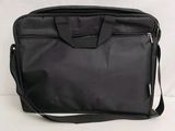 an image of a black bag sitting on top of a white surface