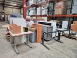 a lot of furniture in a warehouse with a lot of shelves