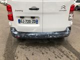 a white van that is parked in a parking lot