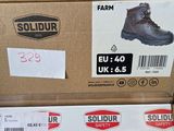 boxes of shoes are stacked on top of each other in a store