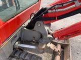 a close up view of the front end of a red bulldozer