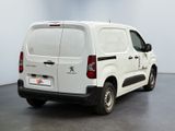 a white van that is parked in a room
