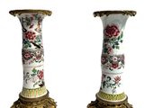 two vases that have been decorated with flowers and birds on them