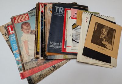 a lot of old magazines sitting on a table
