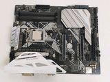 a close up of a motherboard with a mouse on top of it