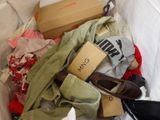 a box full of clothes and a pair of shoes in it