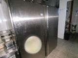 an image of a kitchen with a stainless steel refrigerator