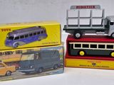 three boxed toy vehicles that are on top of each other