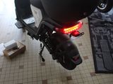 a motorcycle that is parked in a room with other motorcycles