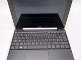 a laptop with a keyboard on a white surface