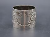 a close up of a silver ring on a table