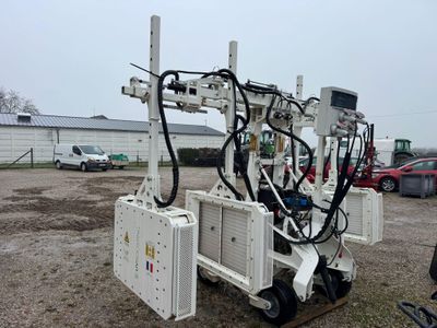 a machine that is sitting on the ground in the dirt