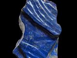 a blue stone sculpture on a black base