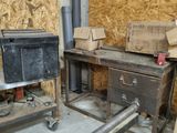 an image of a room with a workbench and a lot of boxes