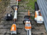four stihs of different types of lawn mowers on the ground
