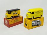 yellow and black toy vehicles in boxes on a white surface