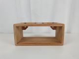 a small wooden box with two bowls on top