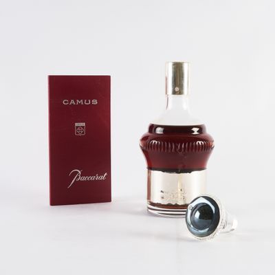 an image of a bottle of perfume next to a box of perfume