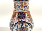 an image of a vase with a floral design on it