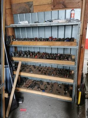 a shelf full of assorted tools in a garage
