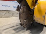 a close up of a machine that is sitting on the ground