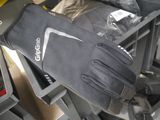 a pair of gloves that are sitting on top of a rack