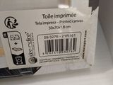 a box of toilet paper on the shelf in the bathroom