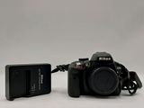 a black camera with a battery attached to it