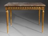 an antique table with a marble top and gold legs