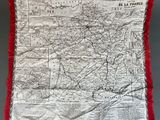 an old map is hanging on a wall with a red border
