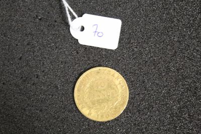 a gold coin with a price tag next to it