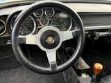 dashboard of a car with a steering wheel and gauges on it