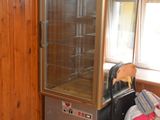 an image of a kitchen with wood paneling and tile flooring