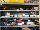 a shelf with many different items on it in a warehouse
