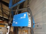 a blue machine that is hanging on the wall