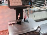an image of a cash register in a grocery store