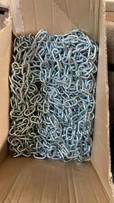 a cardboard box with a bunch of chains inside of it