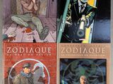 three books of comics are on display on a shelf in a room