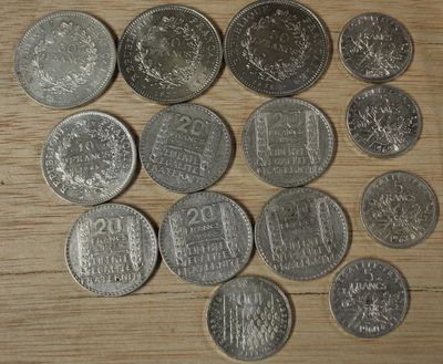 Un lot de monnaies en argent (3 monnaies de 50 Francs, 1 mon…