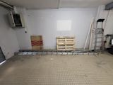 a room with a lot of boxes and a ladder in it