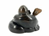buddha figurine sitting on a white background with a brown tag