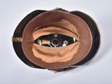 a brown leather bag with a cell phone inside of it