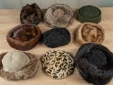 several hats are lined up on top of a wooden table